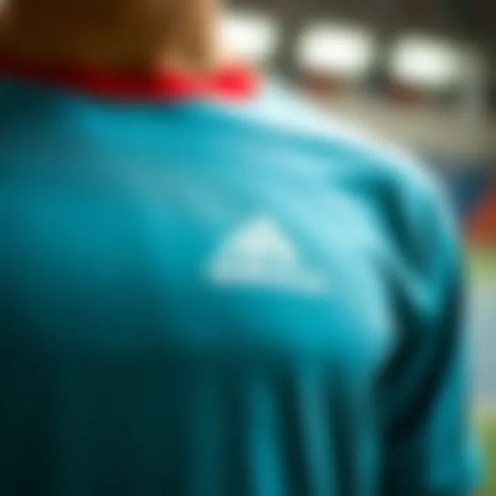 Close-up of Adidas logo on short-sleeved t-shirt