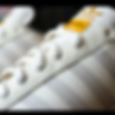 The Details that Define Style Close-up of the textured leather and distinctive three stripes on the Adidas Superstar