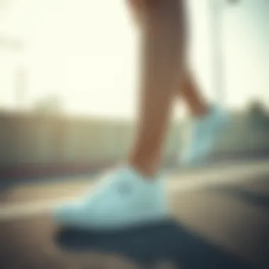 Active individual wearing Puma white sneakers during a workout